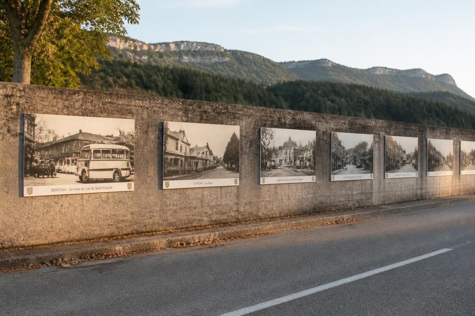 Le Poizat-Lalleyriat : un mur de béton le long de la D55B transformé en galerie d'histoire en plein air 7 découvrez comment un mur de béton le long de la d55b au poizat-lalleyriat a été transformé en une galerie d'histoire en plein air, mêlant art et patrimoine local.